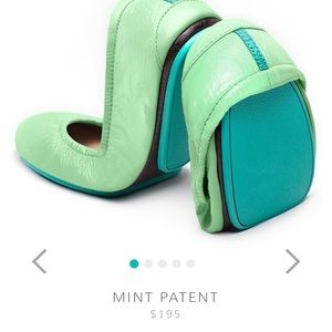 A pair of mint and cream tieks size 5